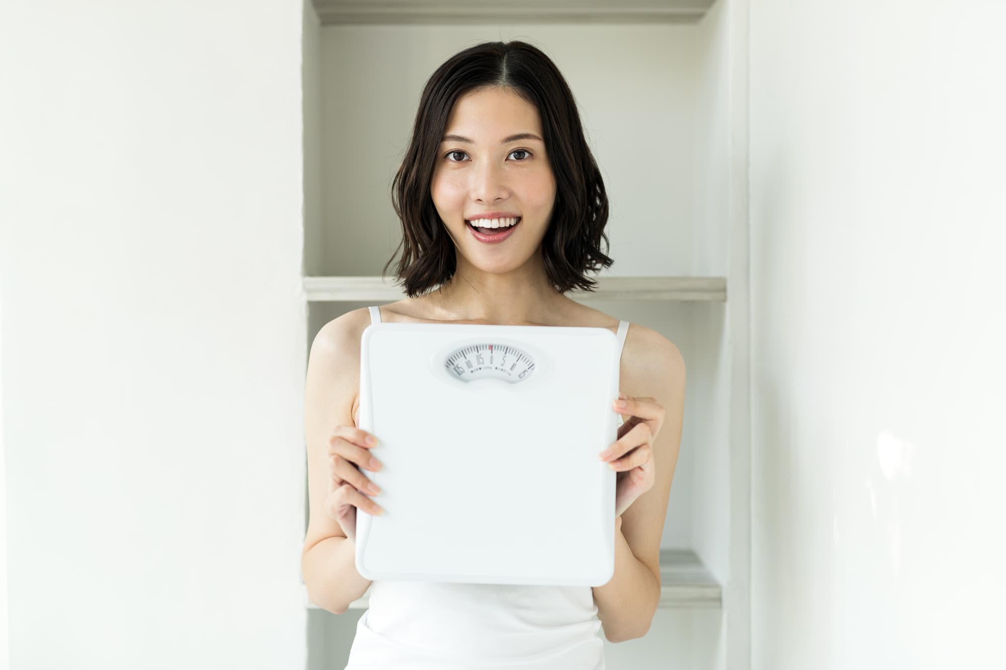 体重が減り喜ぶ女性